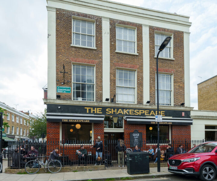 The Shakespeare pub with customers sat outside happily.
